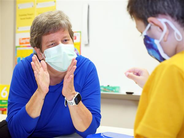 Becky Poston teaching student